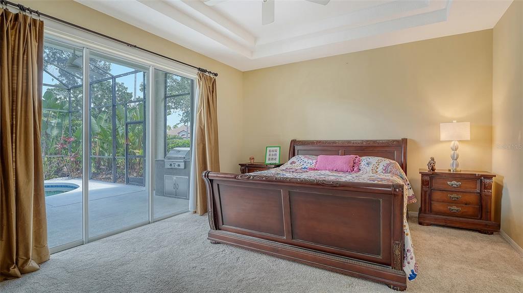 7717 US Open Loop Lakewood Ranch, FL 34202 - Photo 19 of 95 a bedroom with a bed and a view of bedroom
