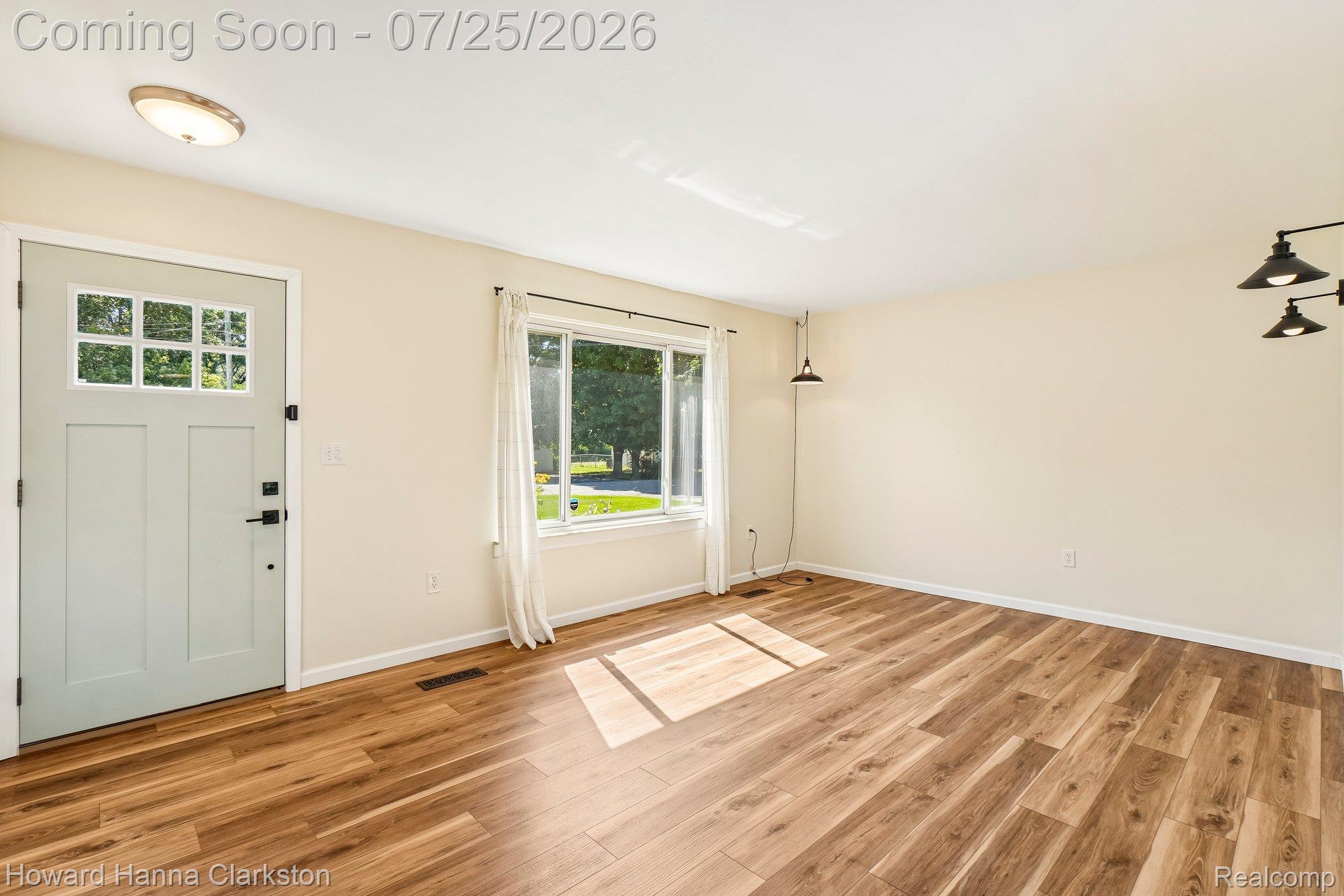 950 Beardon Road Lake Orion, MI 48362 - Photo 5 of 40 You are greeted by an expansive living room that flows into the dining room and kitchen.