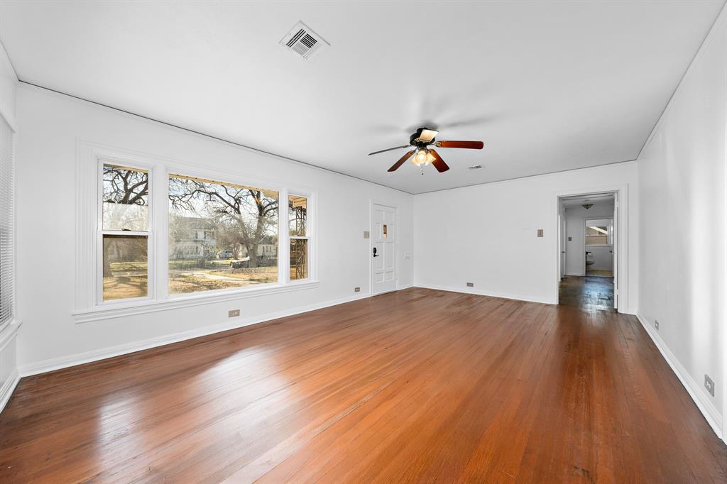 3119 Trice Avenue Waco, TX 76707 - Photo 21 of 40 an empty room with wooden floor and windows