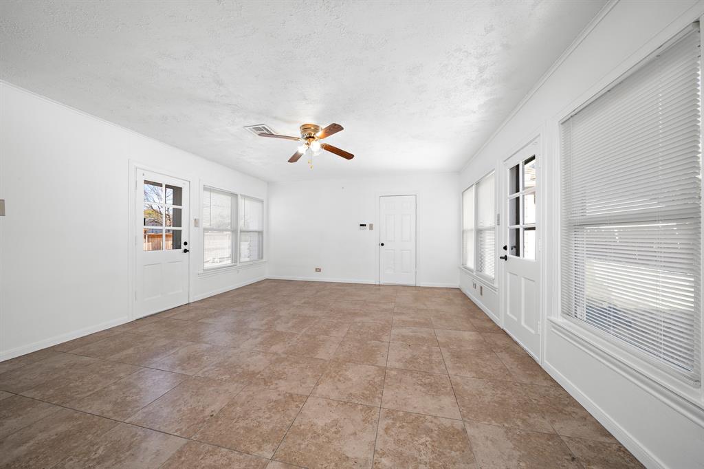 3119 Trice Avenue Waco, TX 76707 - Photo 27 of 40 a view of a livingroom with a ceiling fan and window