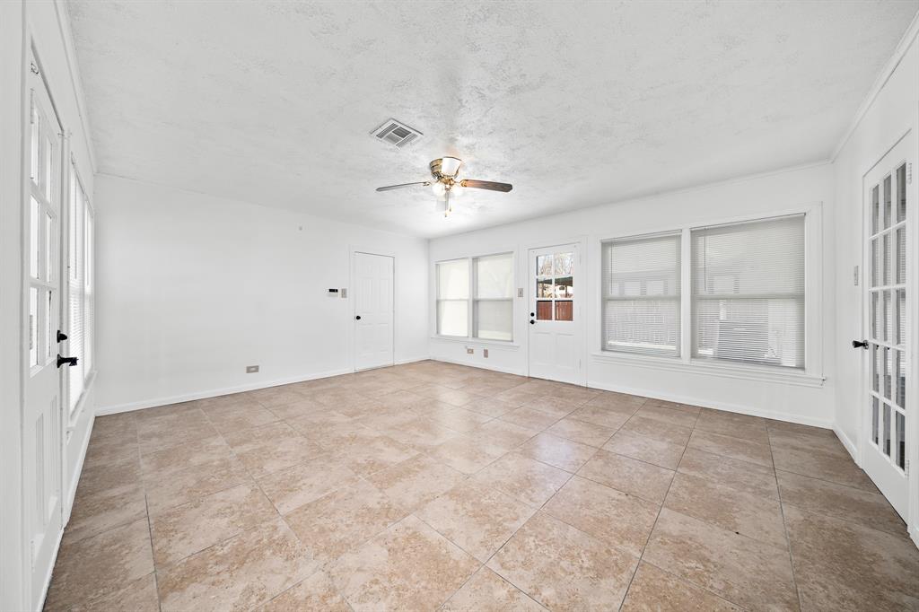 3119 Trice Avenue Waco, TX 76707 - Photo 28 of 40 an empty room with chandelier fan and windows