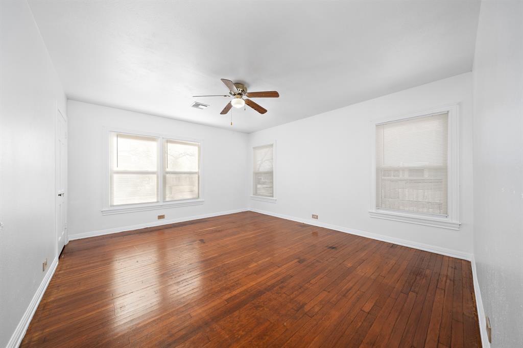 3119 Trice Avenue Waco, TX 76707 - Photo 35 of 40 a view of an empty room with a window and wooden floor