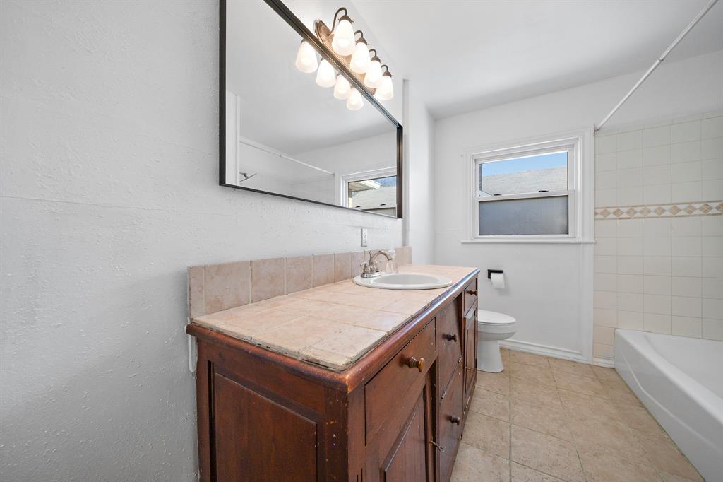 3119 Trice Avenue Waco, TX 76707 - Photo 37 of 40 a bathroom with a sink and a mirror