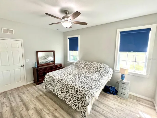 a bedroom with bed and window