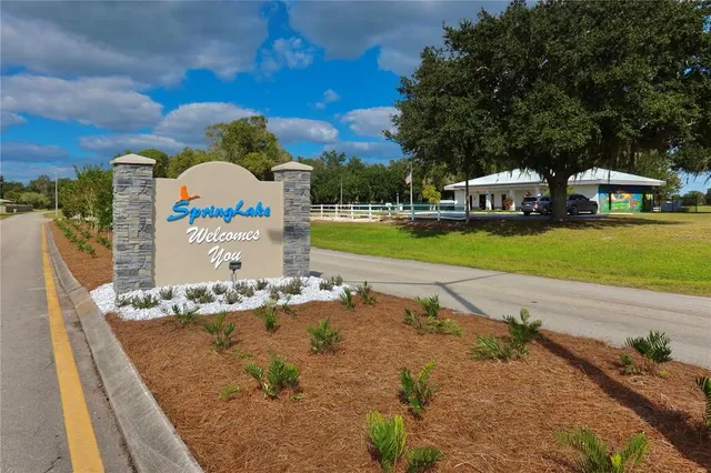 a view of a lake with houses in the background