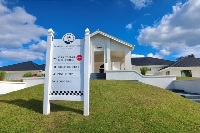 a view of lawn chairs under an umbrella