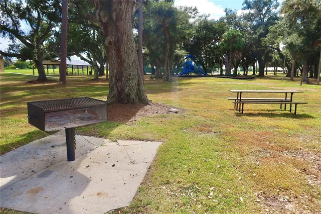 a view of pool with tree s