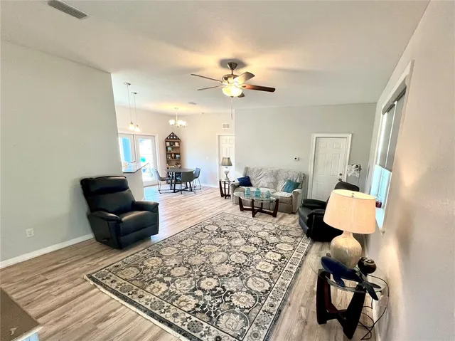 a living room with furniture and a rug