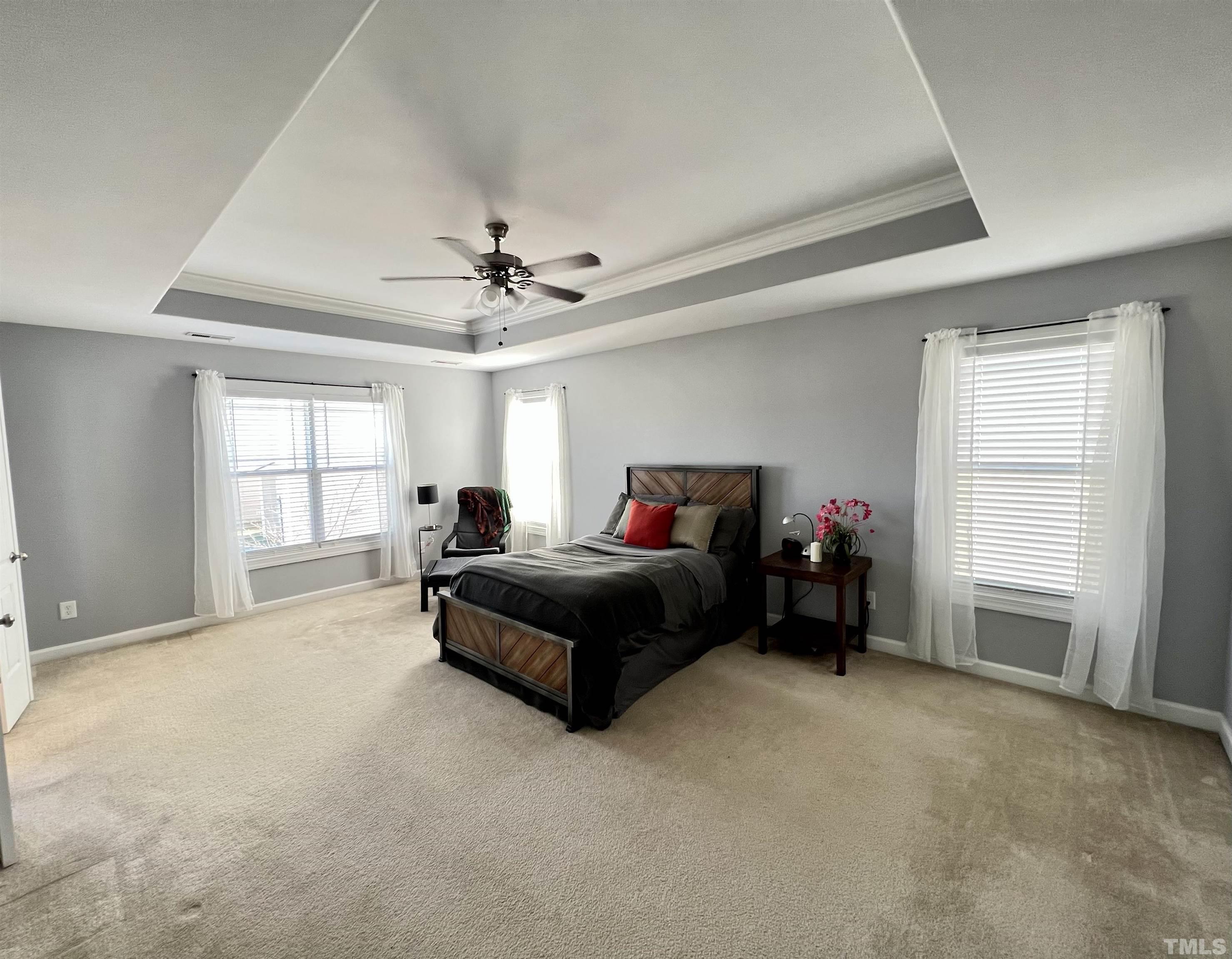 2231 Stoney Spring Drive Raleigh, NC 27610 - Photo 2 of 18 a spacious bedroom with a bed and a window