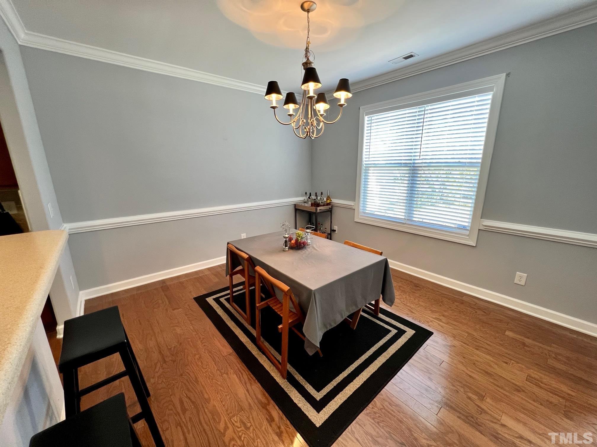 2231 Stoney Spring Drive Raleigh, NC 27610 - Photo 14 of 18 a living room with hard wood floors