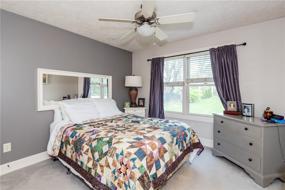159 East Lytle 5 Points Road Springboro, OH 45066 - Photo 18 of 45 This cozy bedroom features a ceiling fan, plush carpet, and a bright window with outdoor???????????????????????? views.