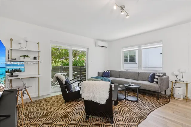 a kitchen with stainless steel appliances cabinets and a table