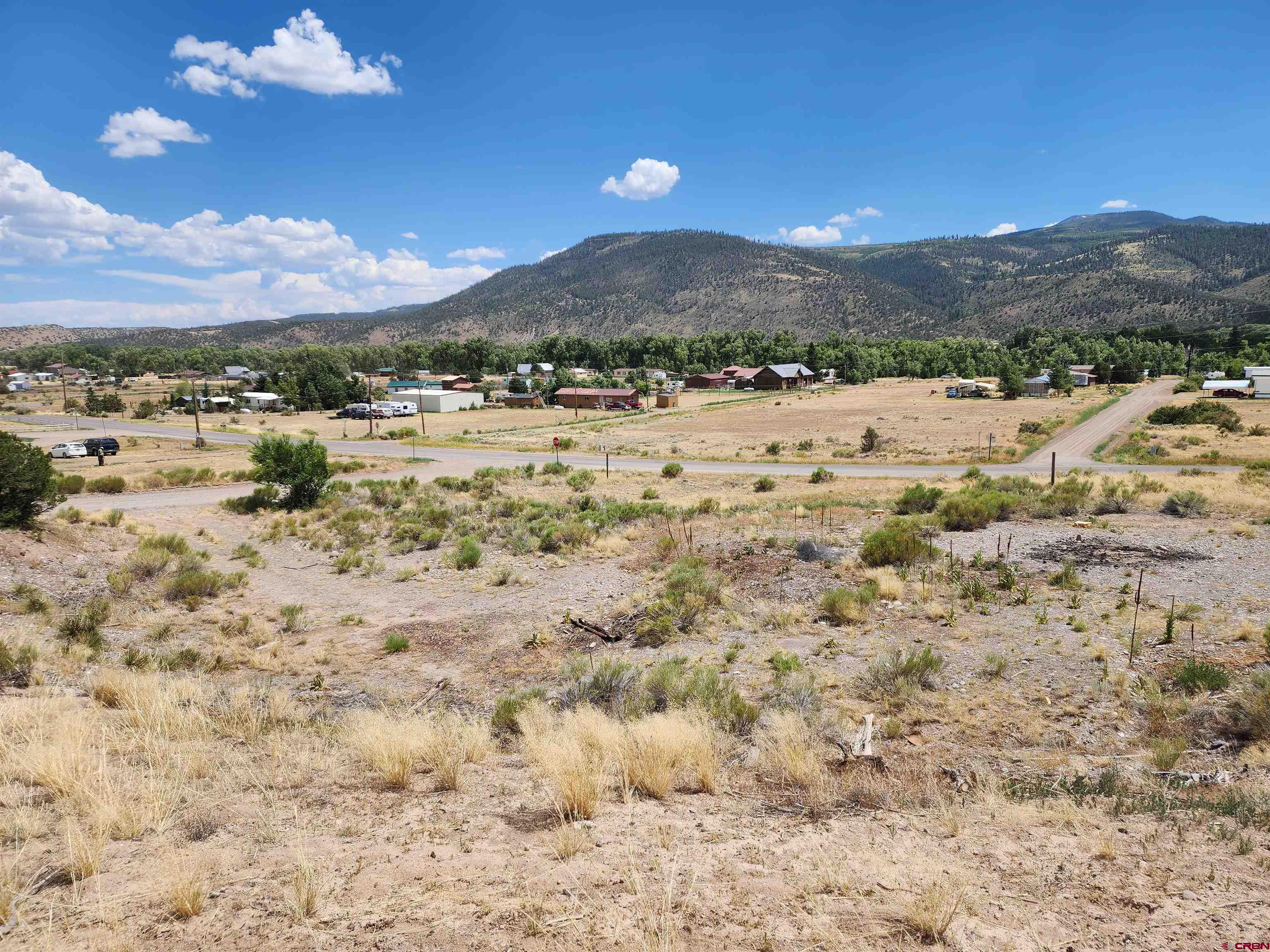 a view of a town with mountains in the background