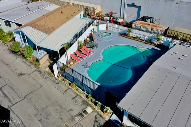 an aerial view of a houses with outdoor space