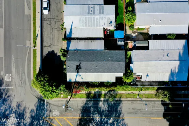 an aerial view of a house with a swimming pool
