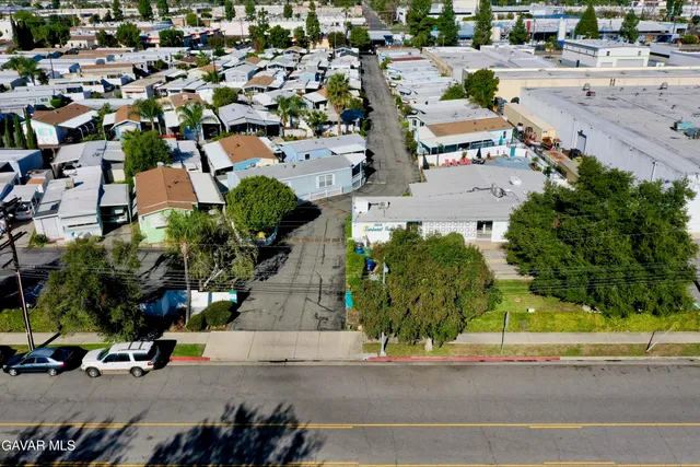 an aerial view of a city with streets and houses