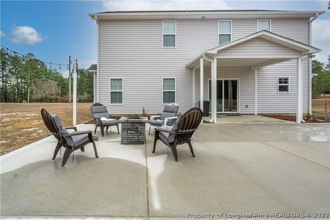 2426 Calloway Road Raeford, NC 28376 - Photo 3 of 50 a view of a house with backyard and sitting area
