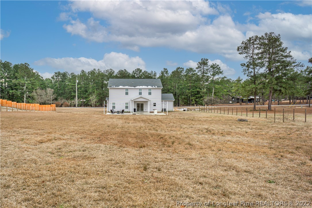 2426 Calloway Road Raeford, NC 28376 - Photo 8 of 50 a backyard of a house with lots of green space