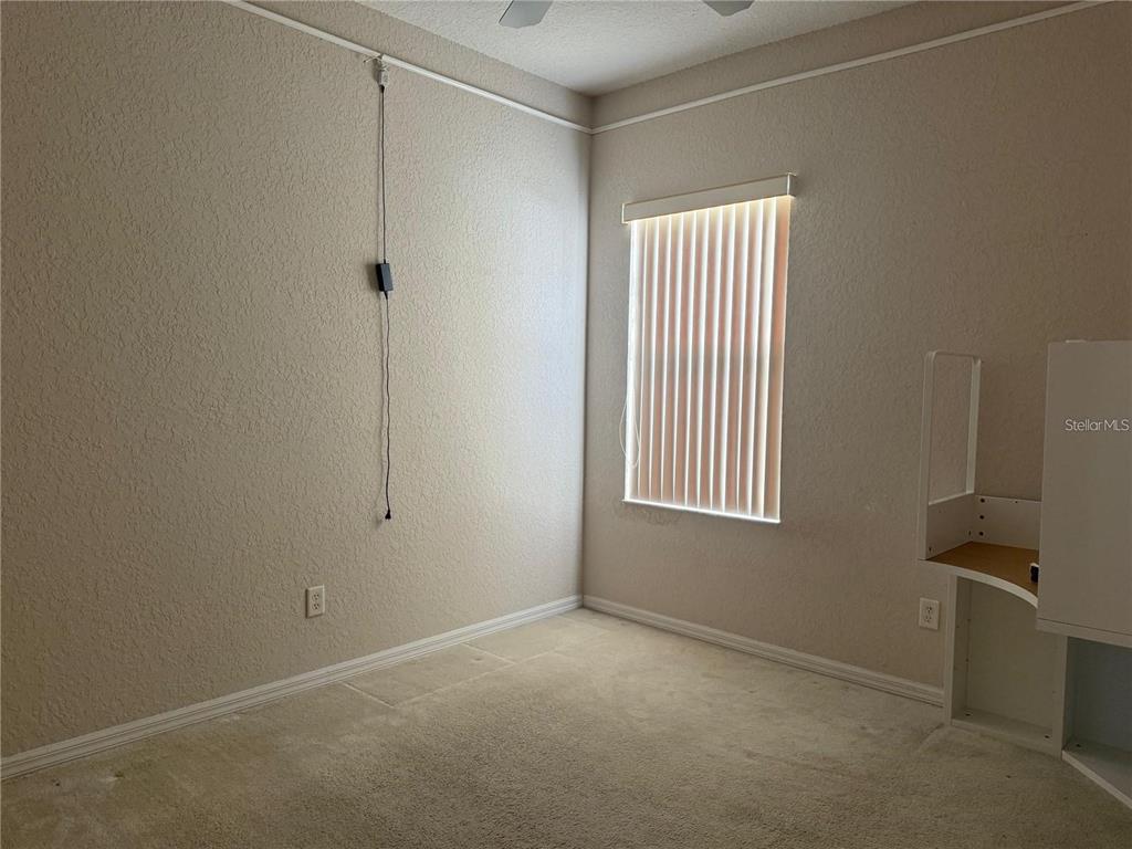 525 Corvina Drive Davenport, FL 33897 - Photo 12 of 15 a view of an empty room with a window