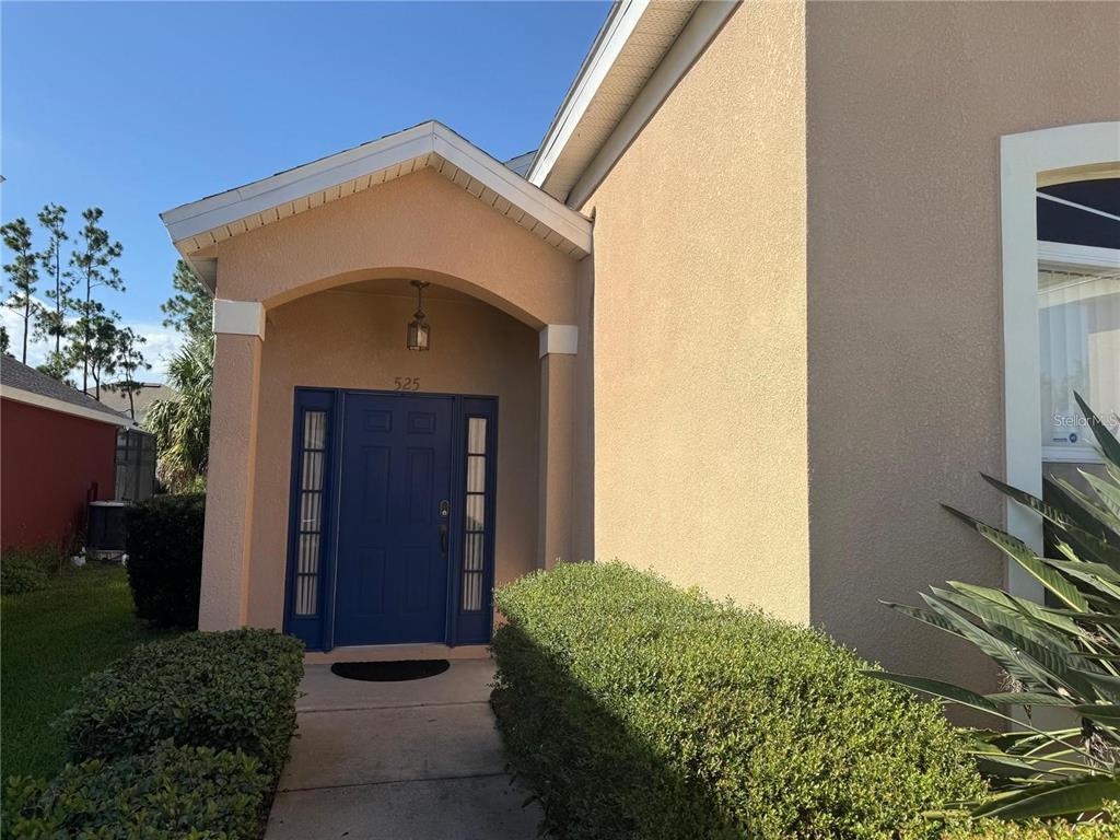 525 Corvina Drive Davenport, FL 33897 - Photo 5 of 15 a front view of a house with a yard