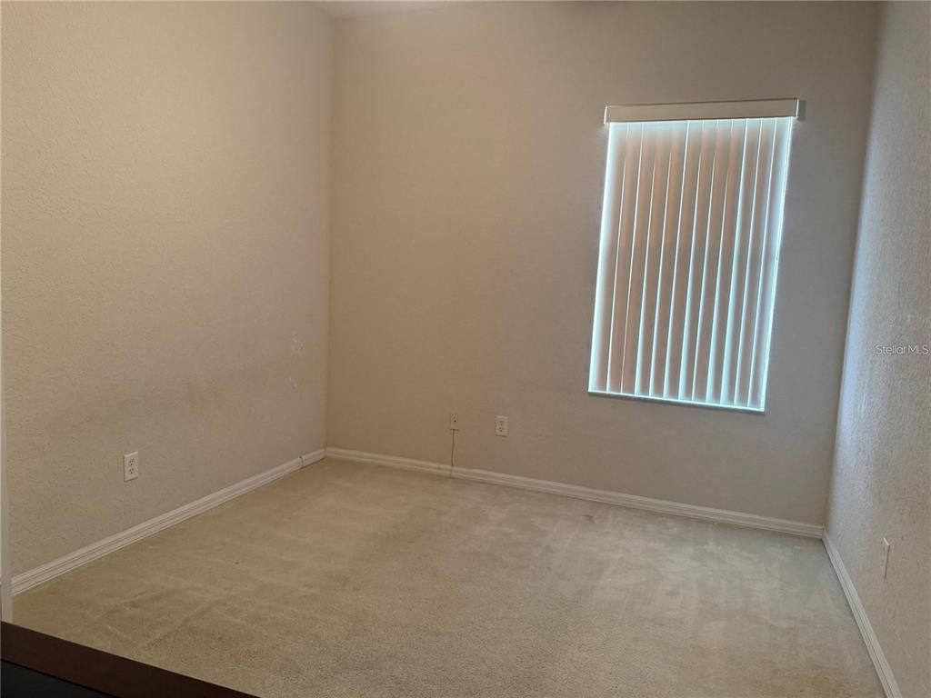 525 Corvina Drive Davenport, FL 33897 - Photo 10 of 15 an empty room with a window