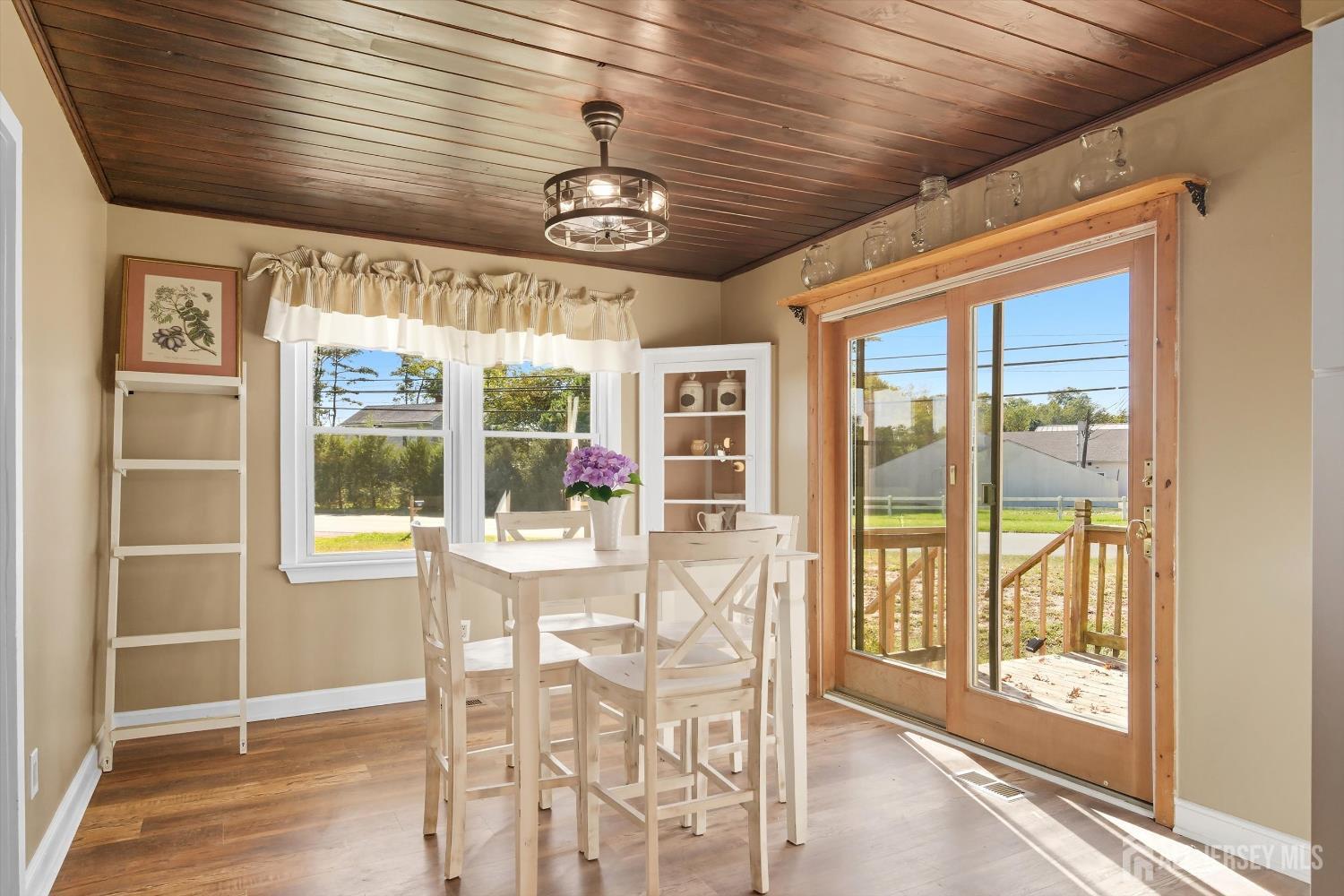 2092 Main Road Newfield, NJ 08344 - Photo 11 of 29 a view of a dining room with furniture wooden floor and chandelier