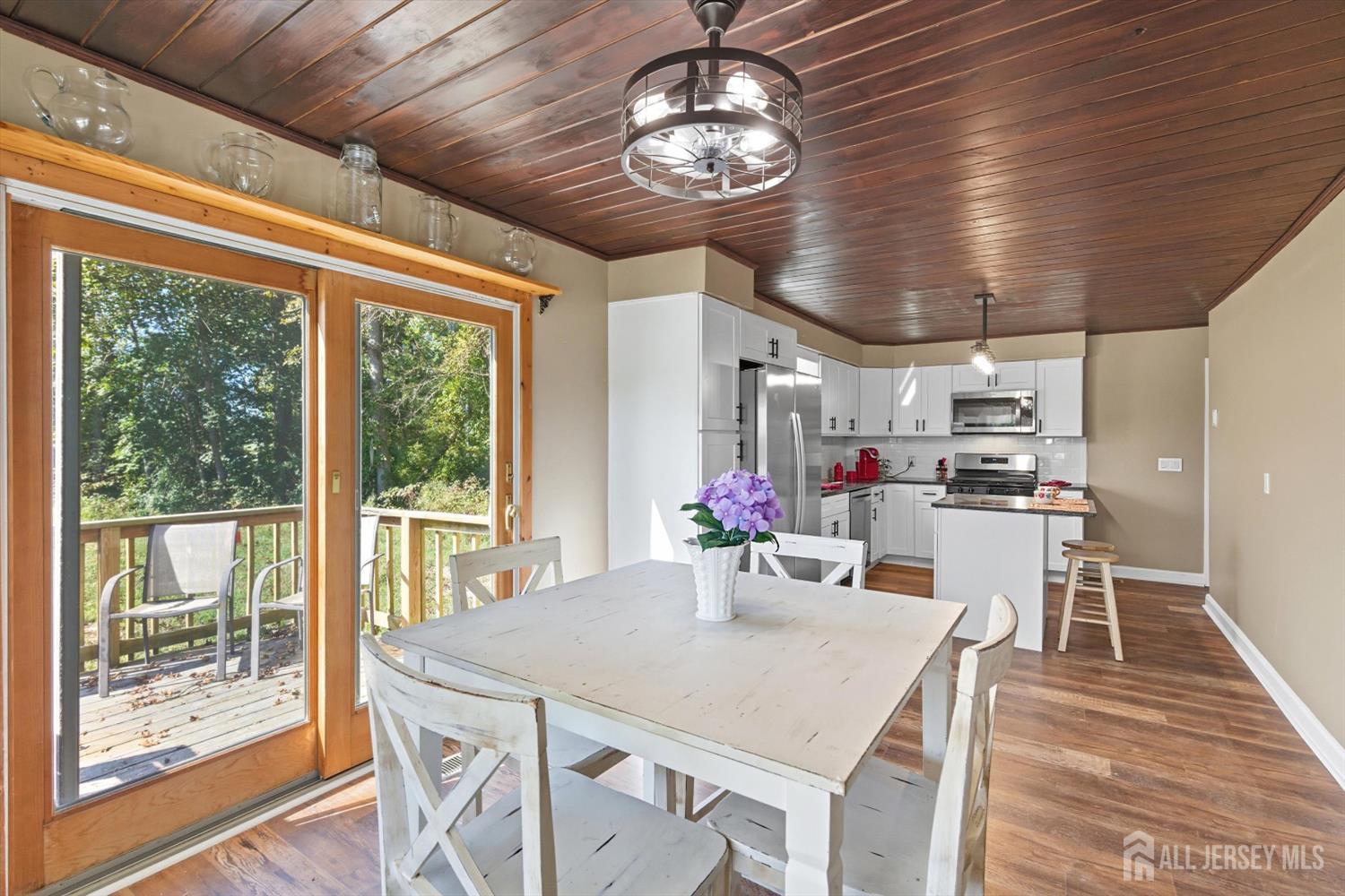 2092 Main Road Newfield, NJ 08344 - Photo 12 of 29 a view of a dining room with furniture wooden floor and chandelier