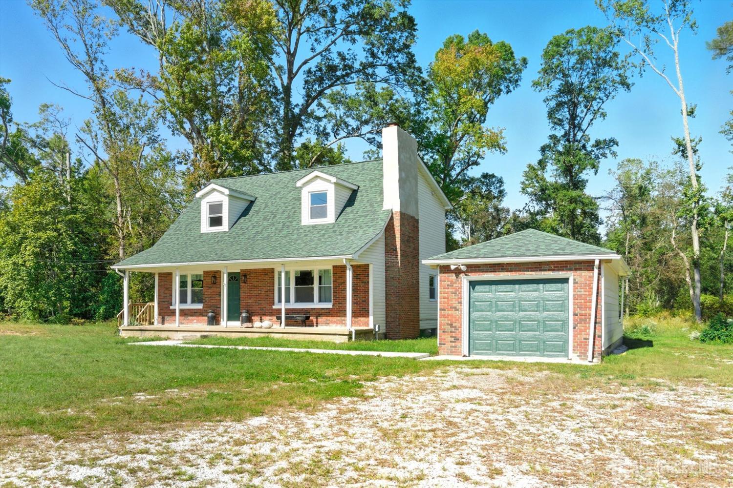 2092 Main Road Newfield, NJ 08344 - Photo 2 of 29 a front view of a house with a garden