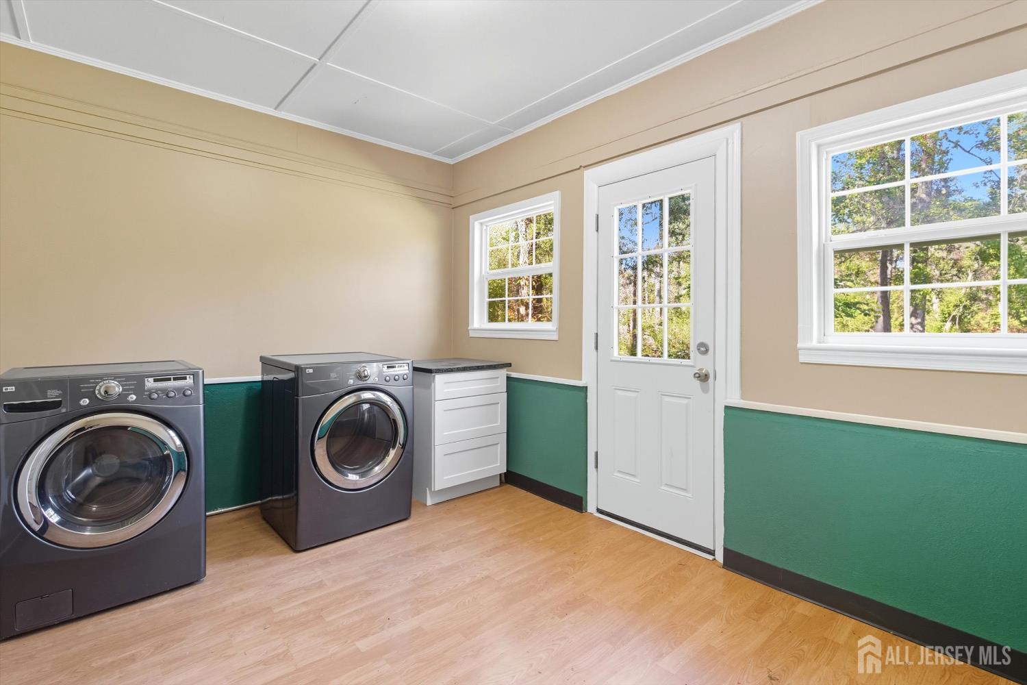 2092 Main Road Newfield, NJ 08344 - Photo 23 of 29 a bedroom with a washer and dryer next to window