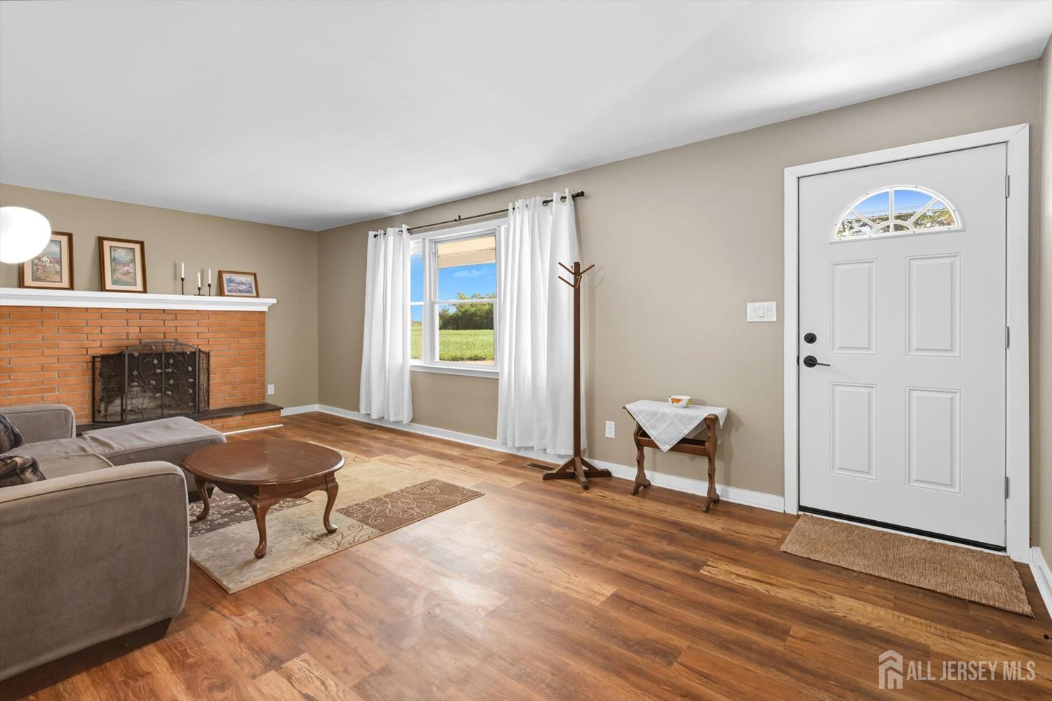 2092 Main Road Newfield, NJ 08344 - Photo 5 of 29 a living room with furniture and a fireplace