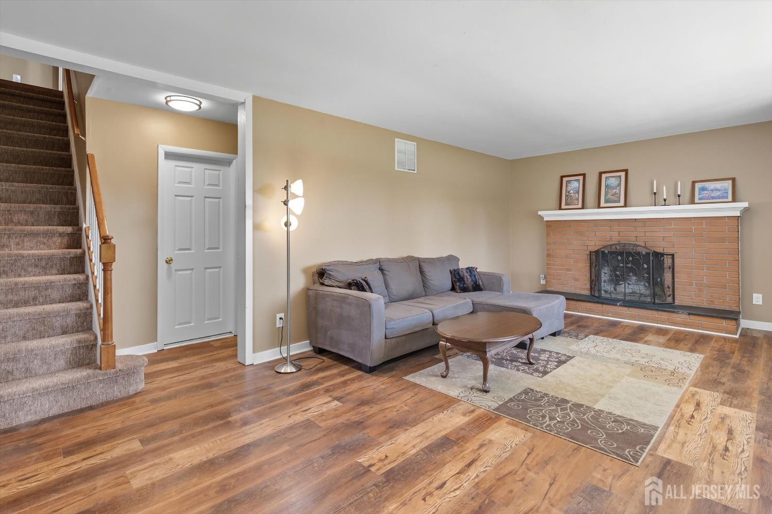 2092 Main Road Newfield, NJ 08344 - Photo 6 of 29 a living room with furniture and a fireplace
