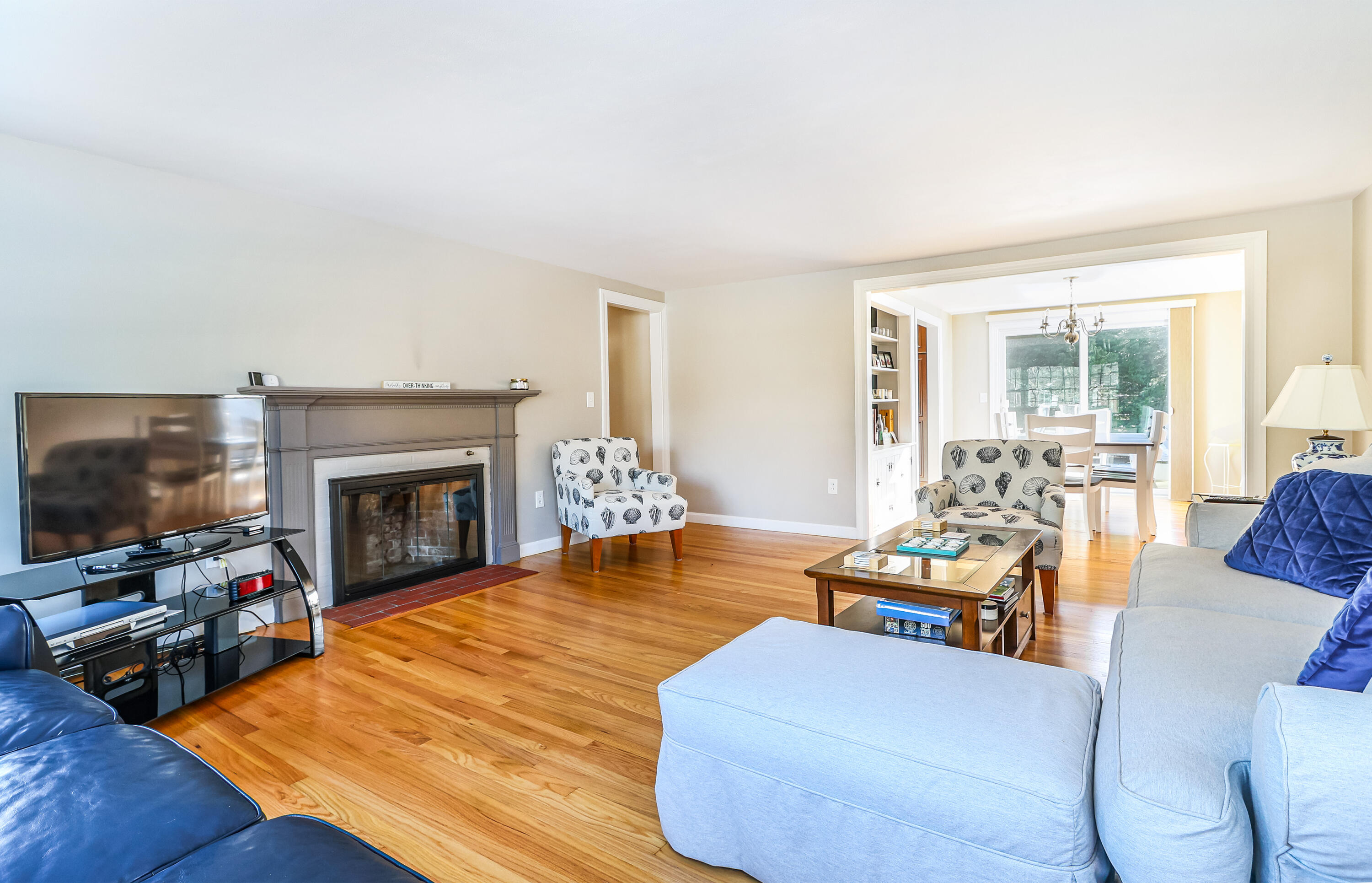 15 Captain Small Road South Yarmouth, MA 02664 - Photo 12 of 22 a living room with furniture a fireplace and a flat screen tv