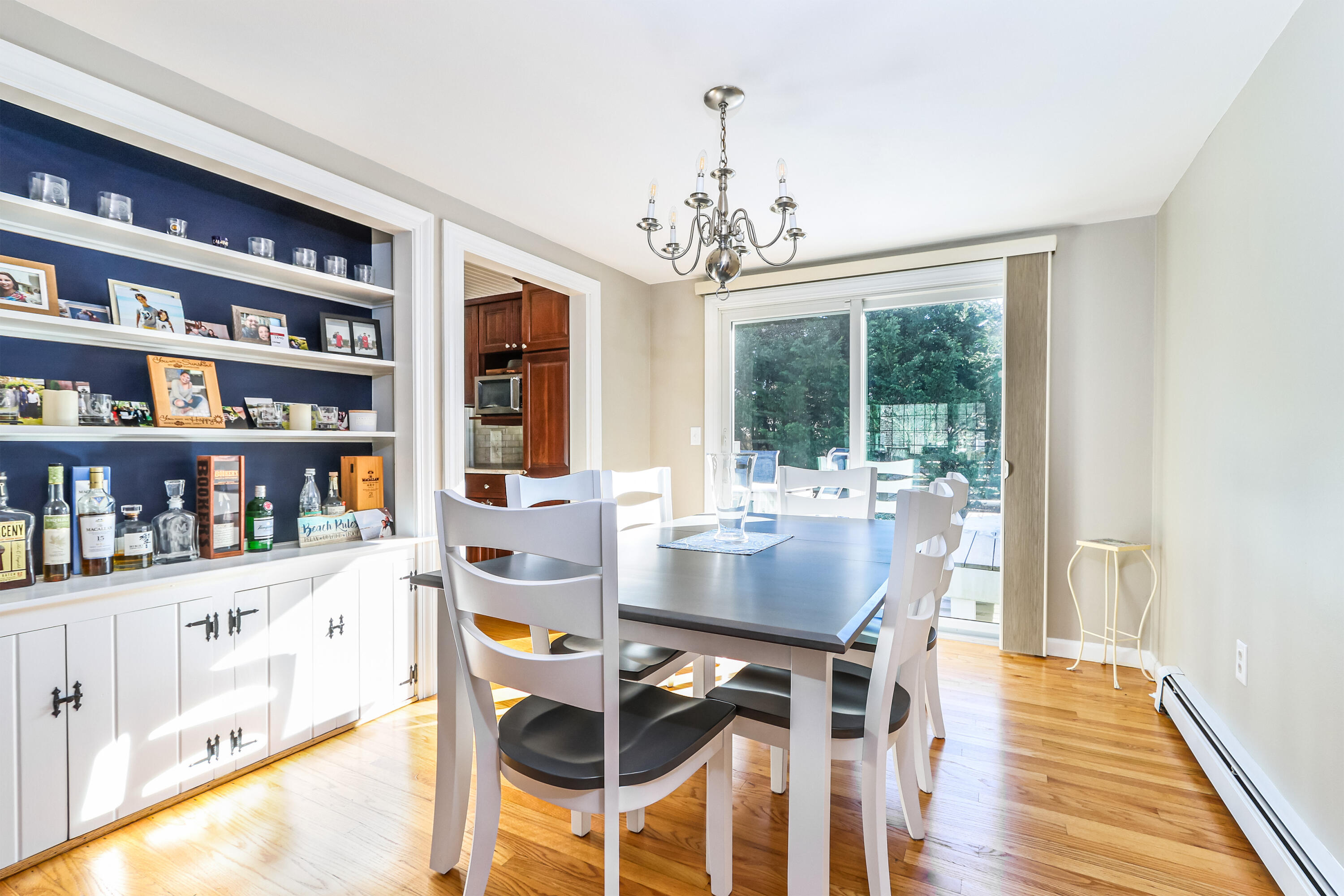 15 Captain Small Road South Yarmouth, MA 02664 - Photo 14 of 22 a dining room with furniture a rug and wooden floor