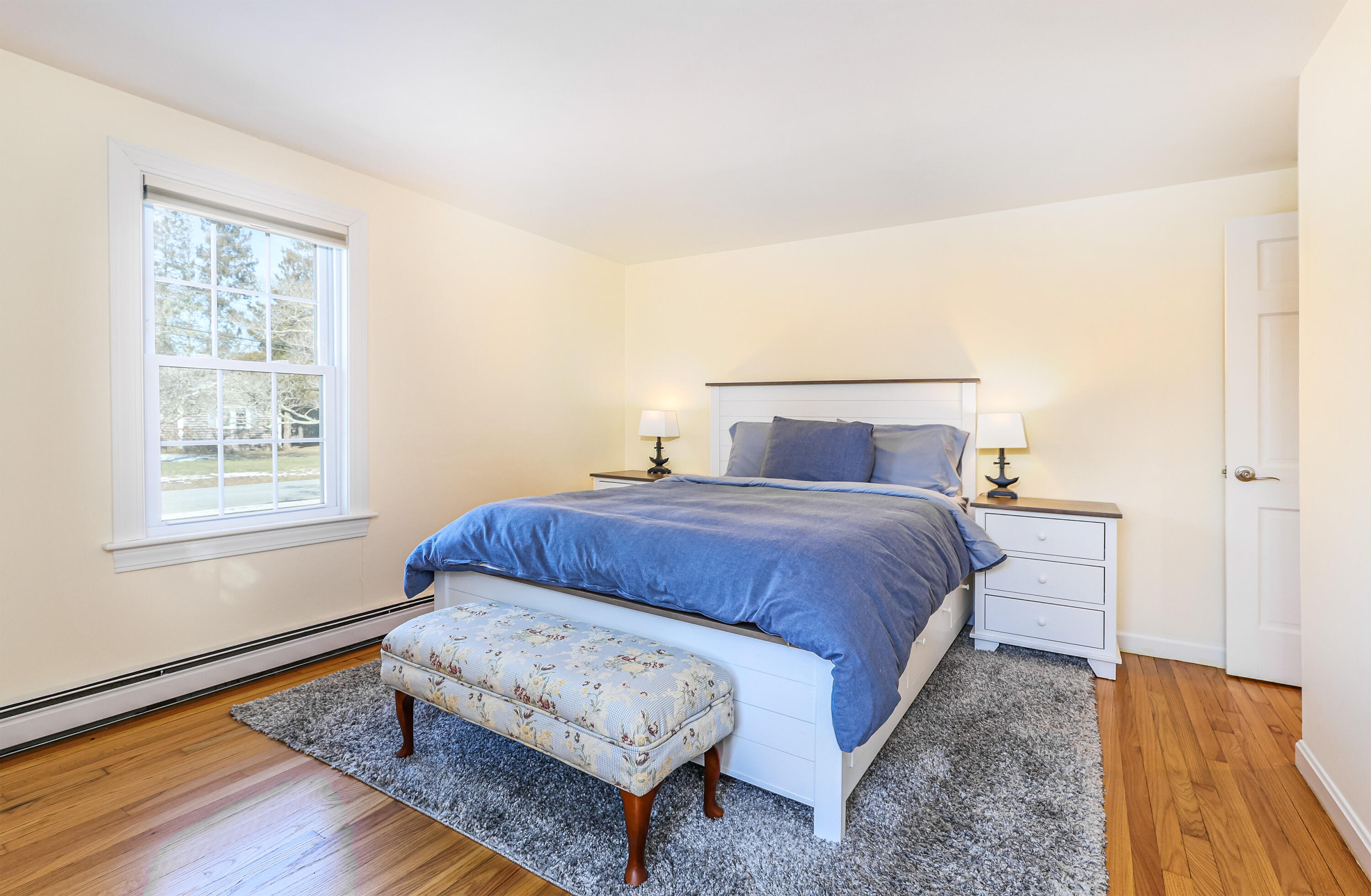 15 Captain Small Road South Yarmouth, MA 02664 - Photo 19 of 22 a bedroom with a bed and wooden floor