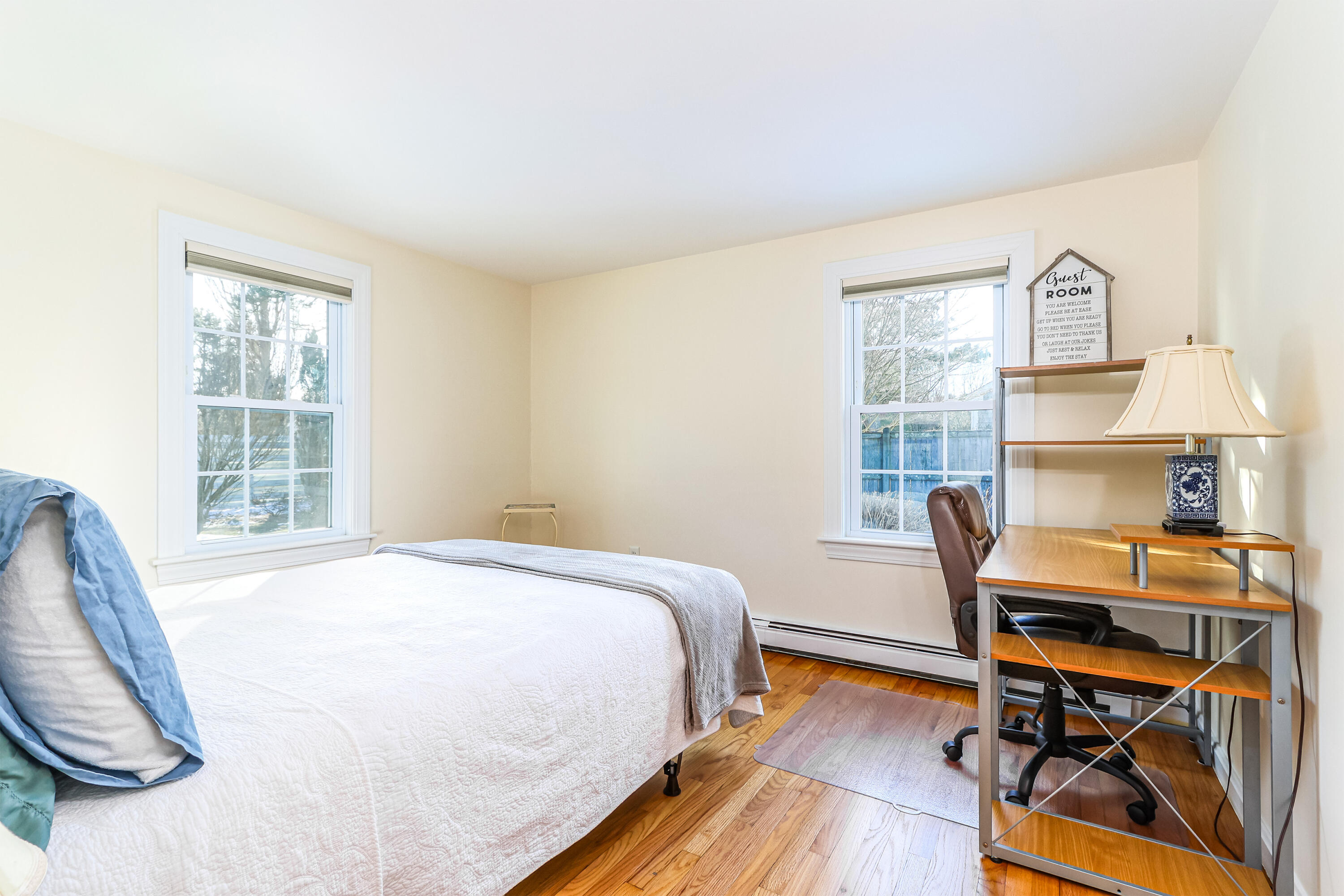 15 Captain Small Road South Yarmouth, MA 02664 - Photo 20 of 22 a bedroom with a bed a table and windows