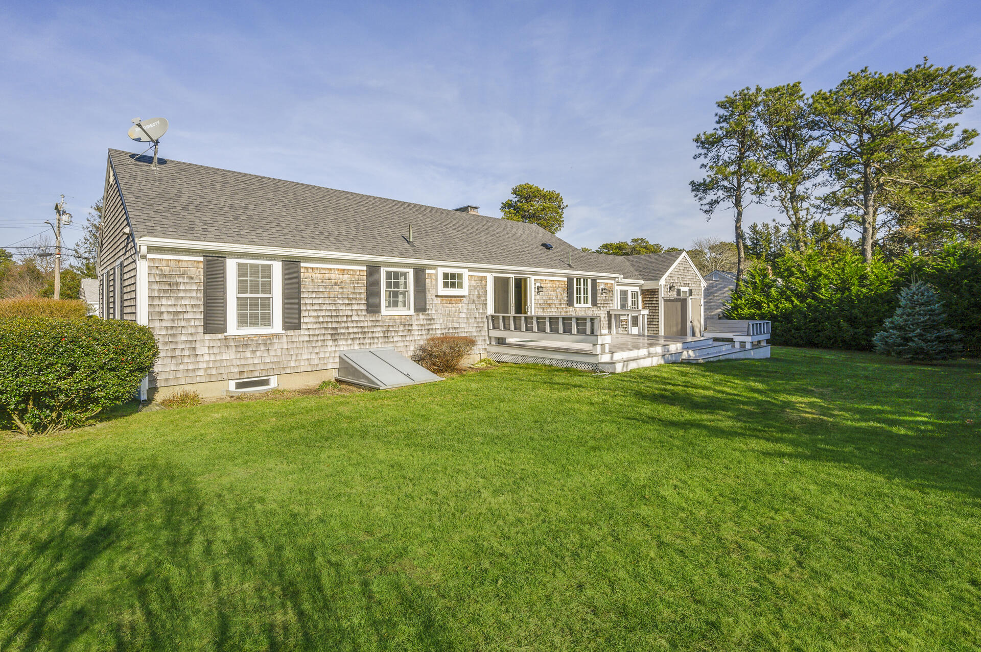 15 Captain Small Road South Yarmouth, MA 02664 - Photo 2 of 22 a view of a house with a backyard and porch