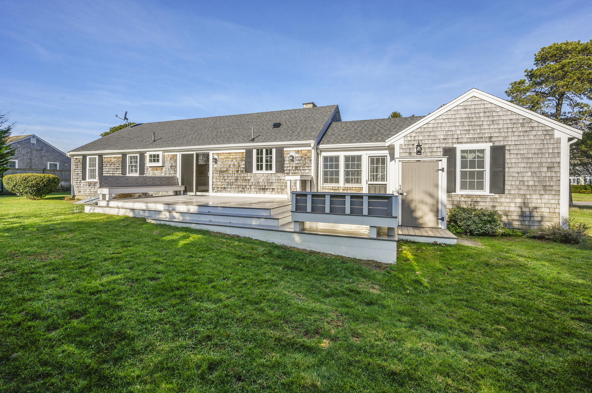 15 Captain Small Road South Yarmouth, MA 02664 - Photo 3 of 22 a front view of a house with a yard and trees