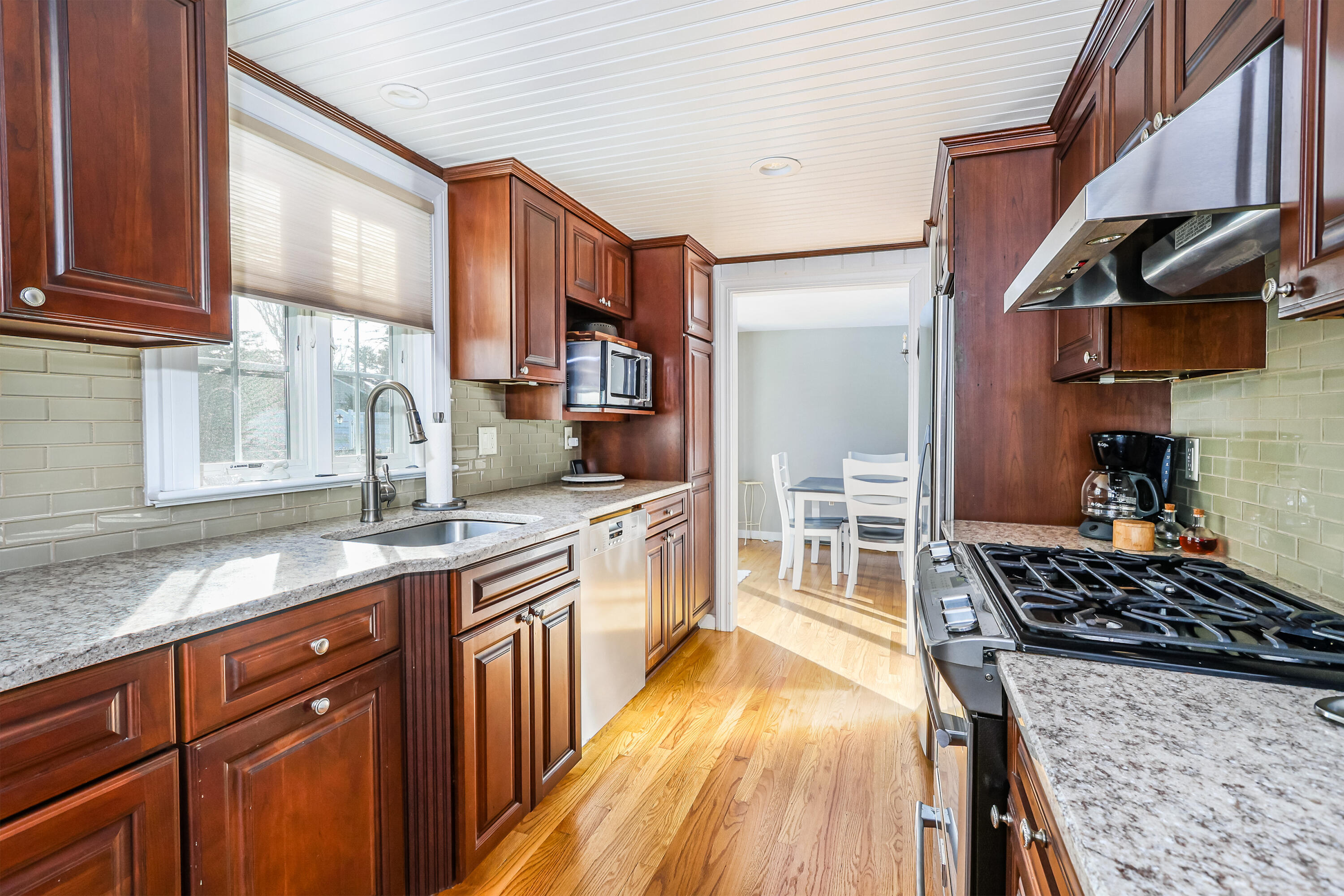 15 Captain Small Road South Yarmouth, MA 02664 - Photo 7 of 22 a kitchen with stainless steel appliances granite countertop a stove a sink and a microwave