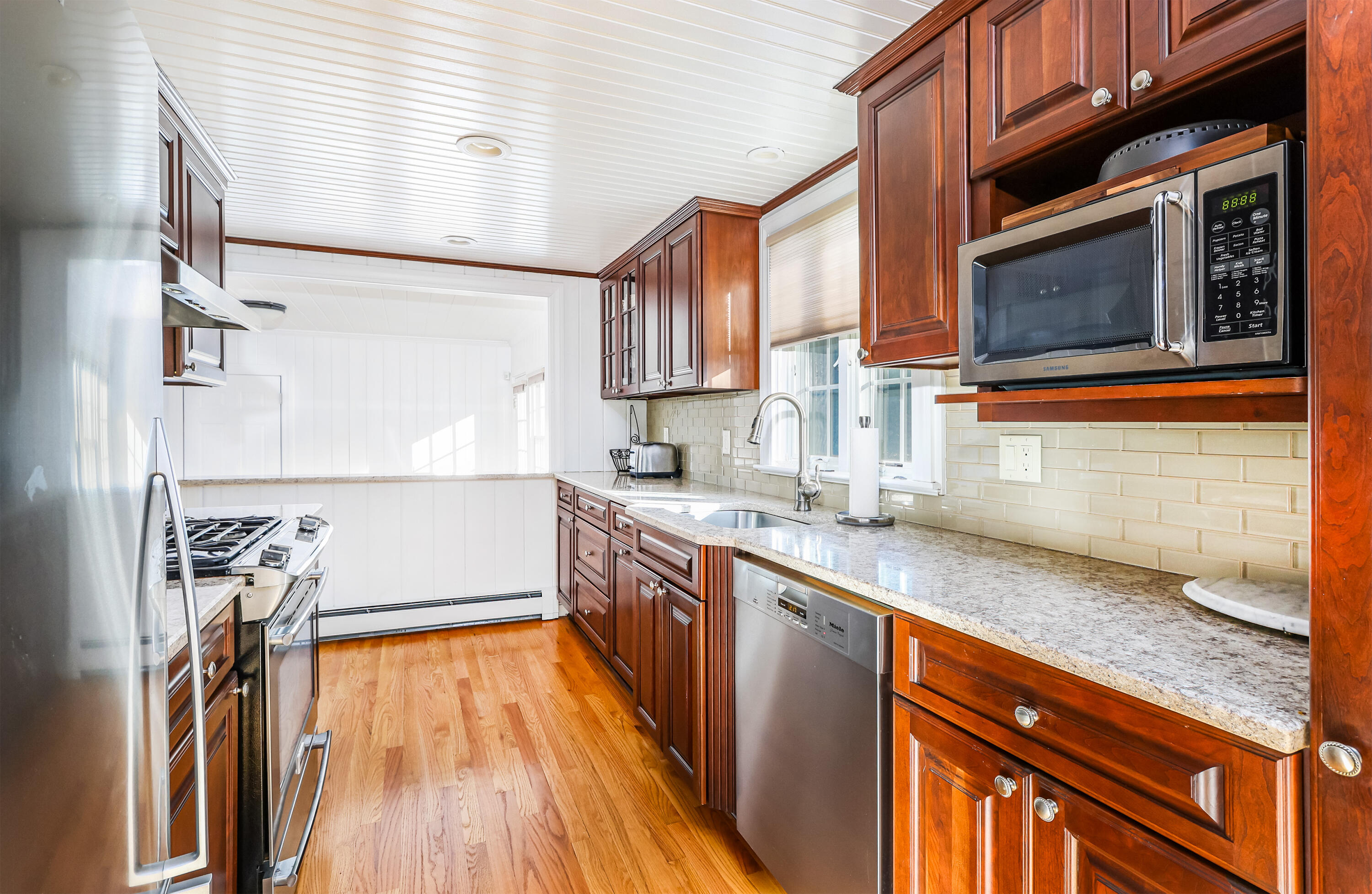15 Captain Small Road South Yarmouth, MA 02664 - Photo 8 of 22 a kitchen with stainless steel appliances granite countertop a sink and a stove