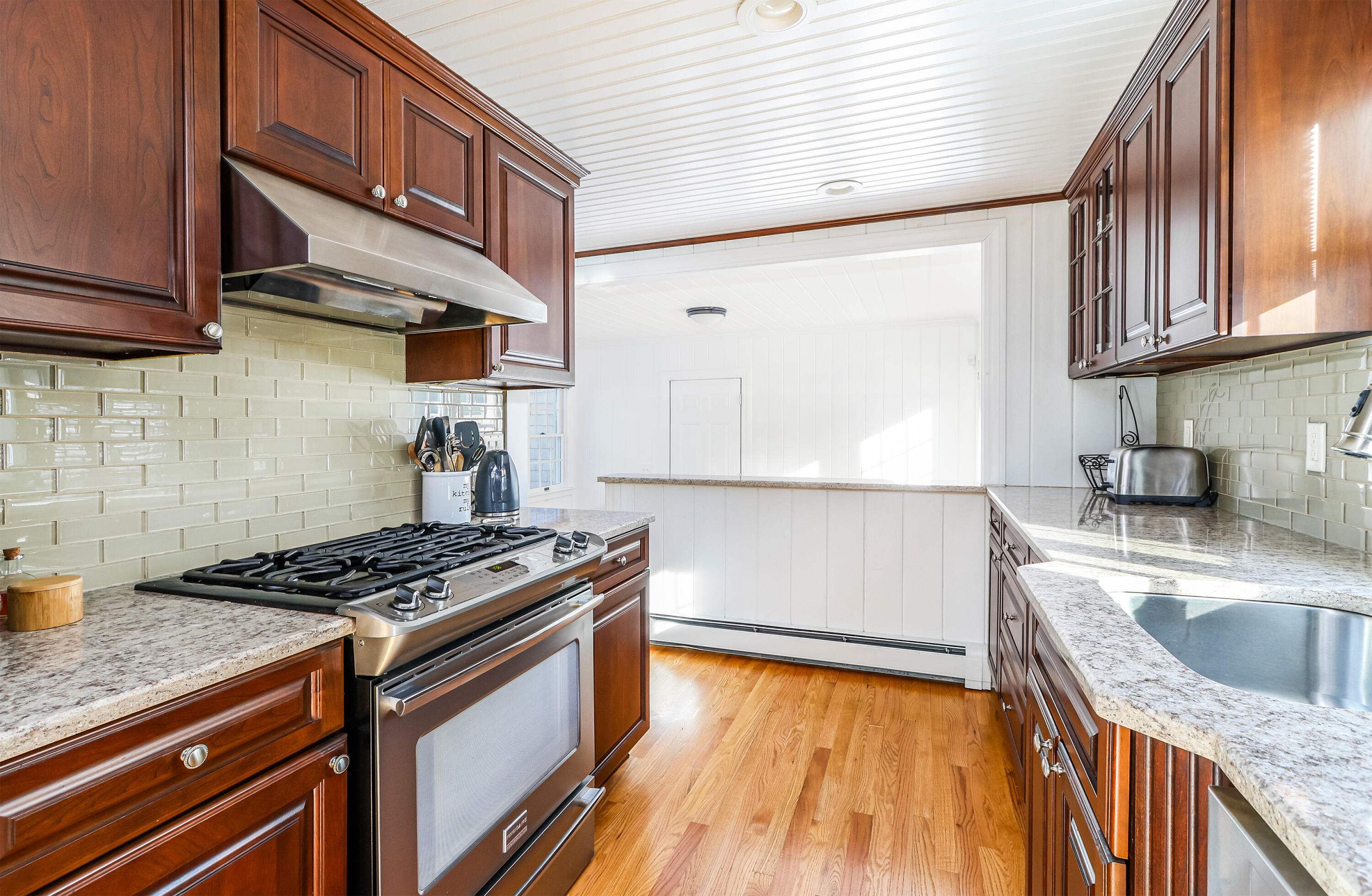 15 Captain Small Road South Yarmouth, MA 02664 - Photo 9 of 22 a kitchen with granite countertop a sink a stove and cabinets