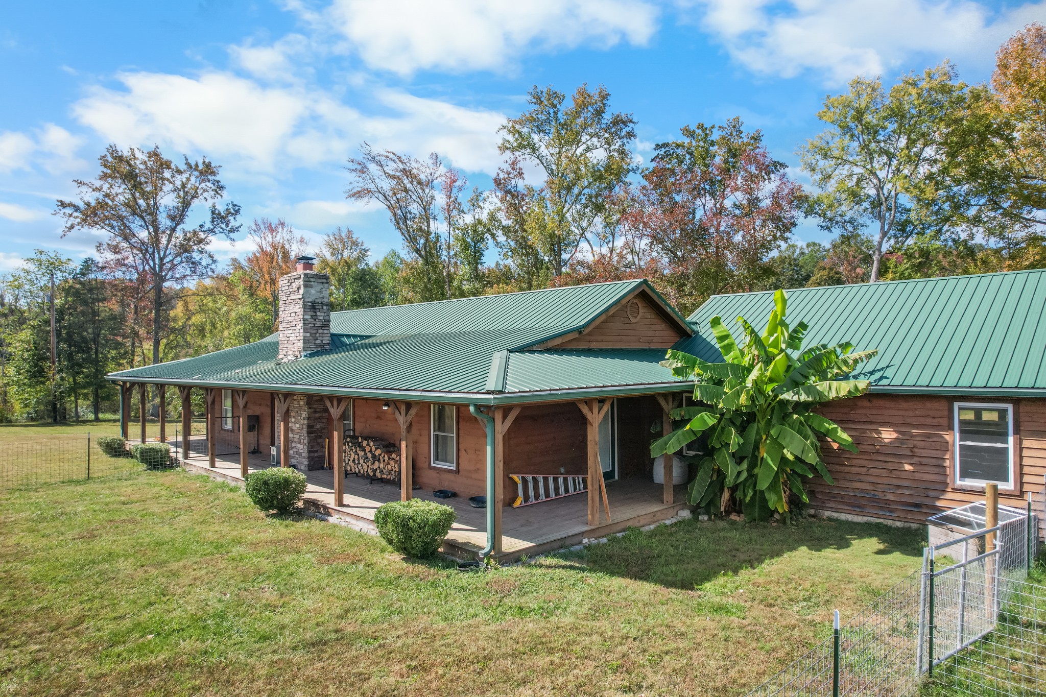 9516 Bakerton Road Red Boiling Springs, TN 37150 - Photo 1 of 60 a front view of a house with garden