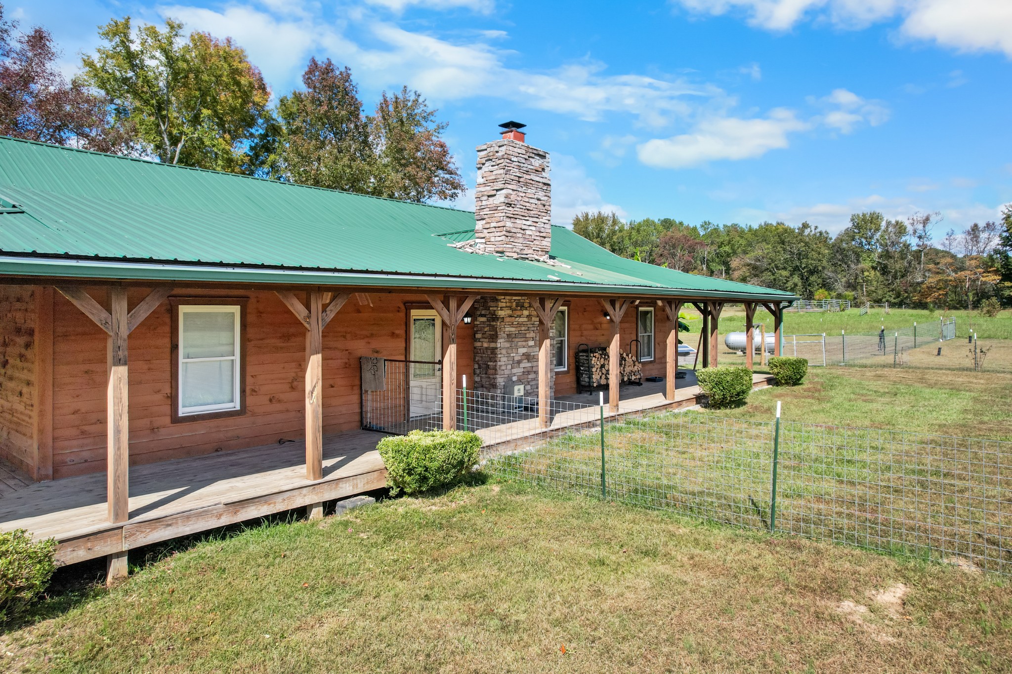 9516 Bakerton Road Red Boiling Springs, TN 37150 - Photo 12 of 60 a view of a house with backyard and porch