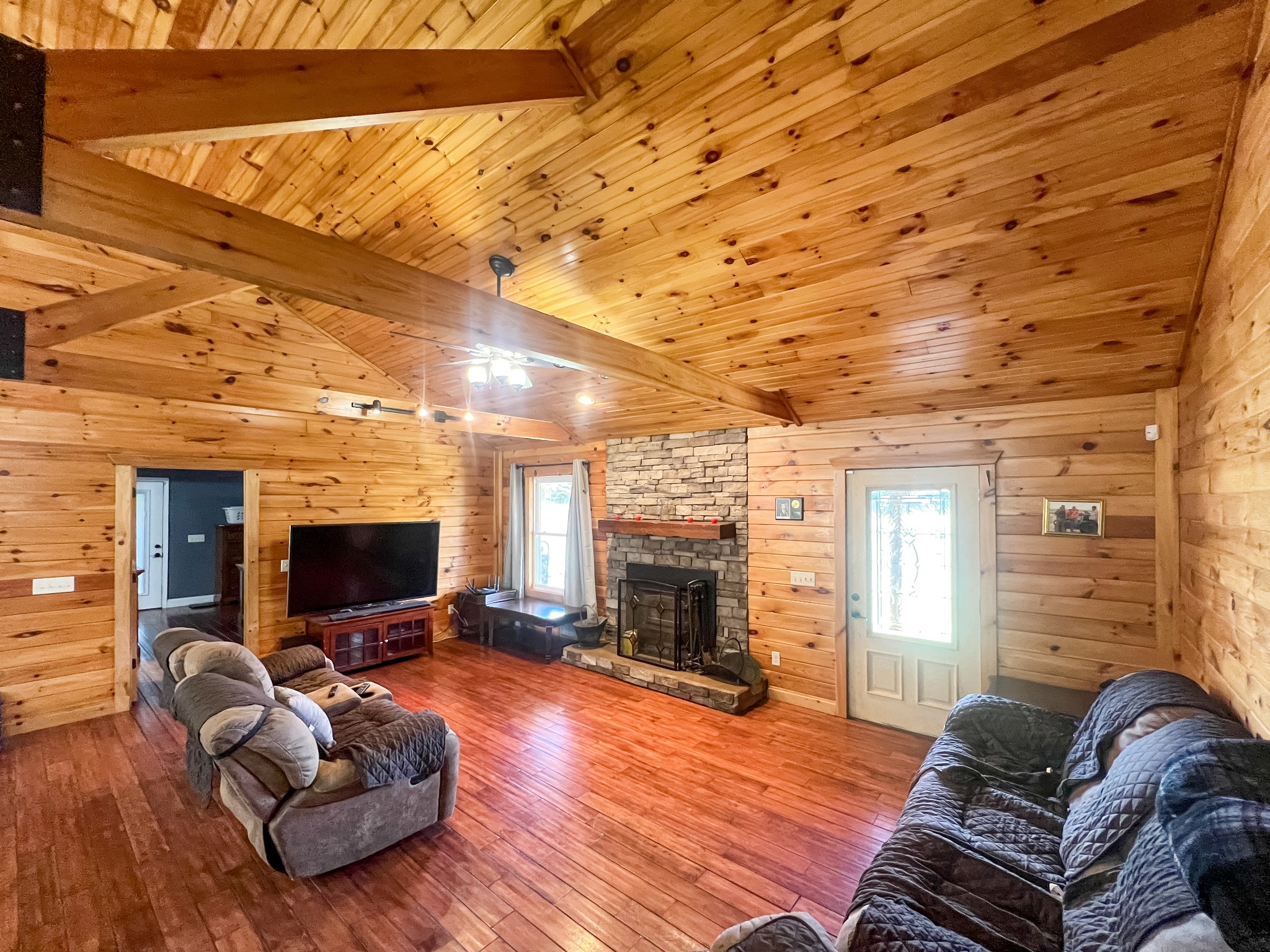 9516 Bakerton Road Red Boiling Springs, TN 37150 - Photo 20 of 60 a living room with furniture a flat screen tv and a fireplace