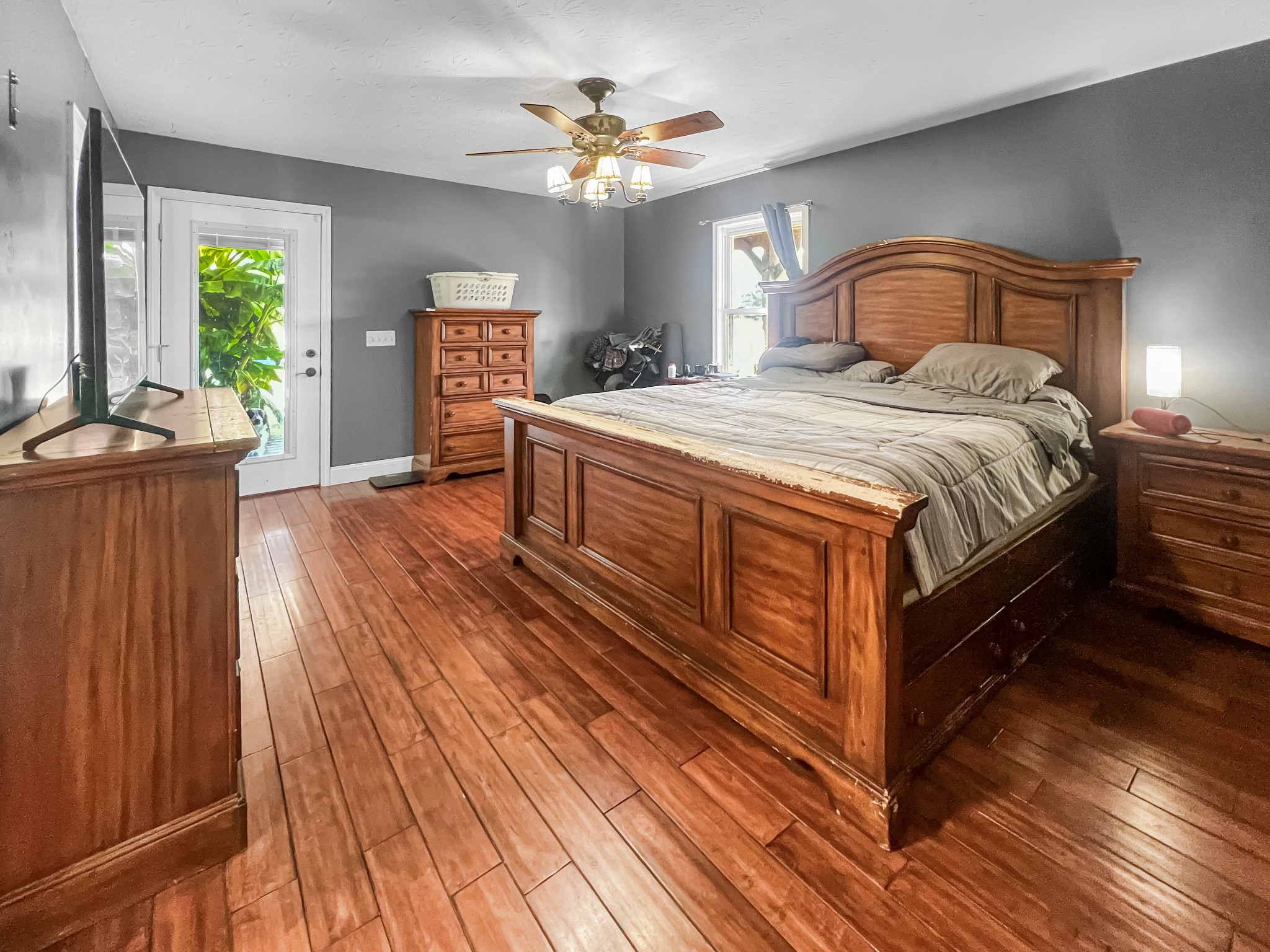 9516 Bakerton Road Red Boiling Springs, TN 37150 - Photo 27 of 60 a spacious bedroom with a bed and a chandelier