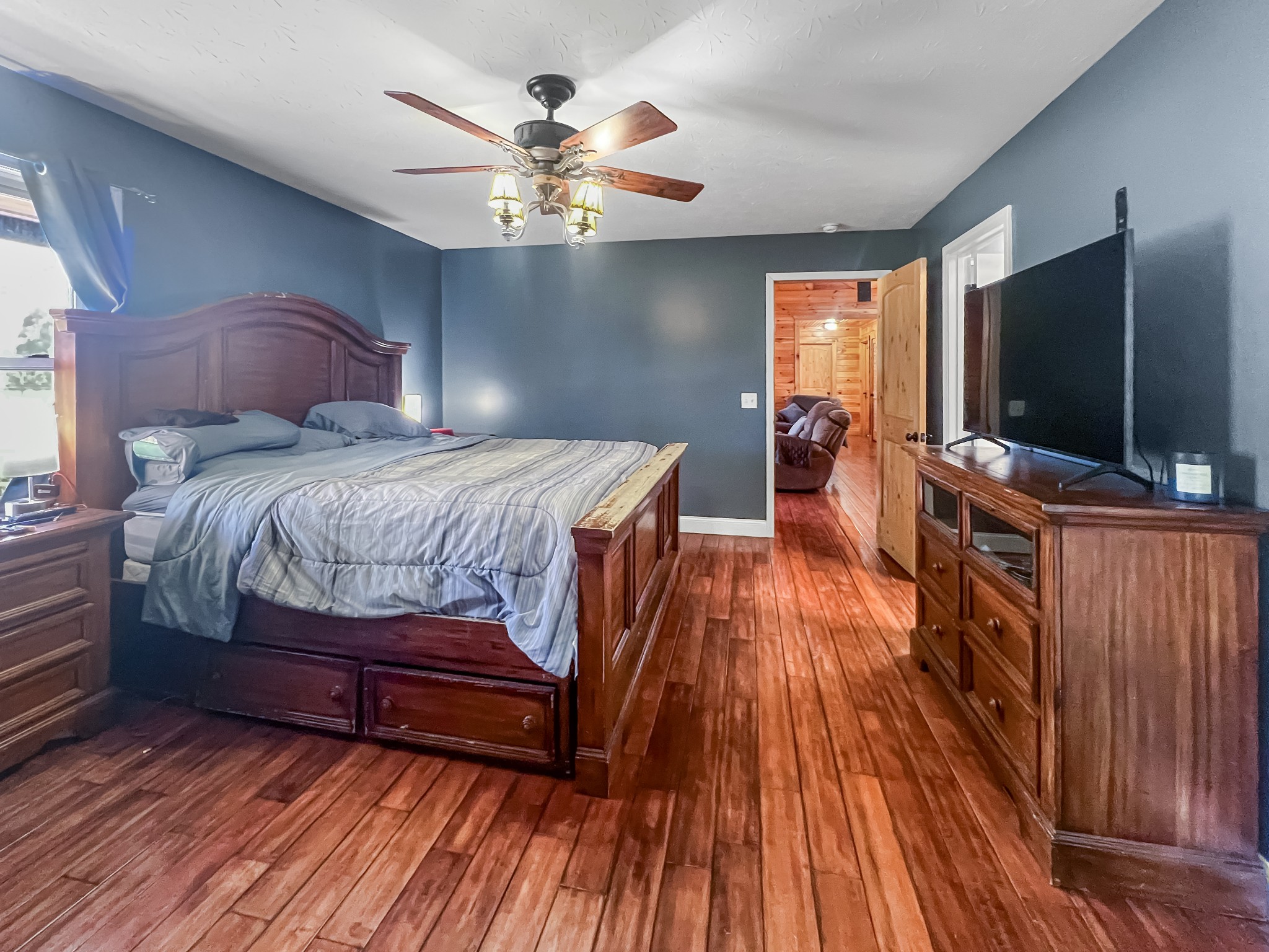 9516 Bakerton Road Red Boiling Springs, TN 37150 - Photo 28 of 60 a bedroom with a bed and wooden floor