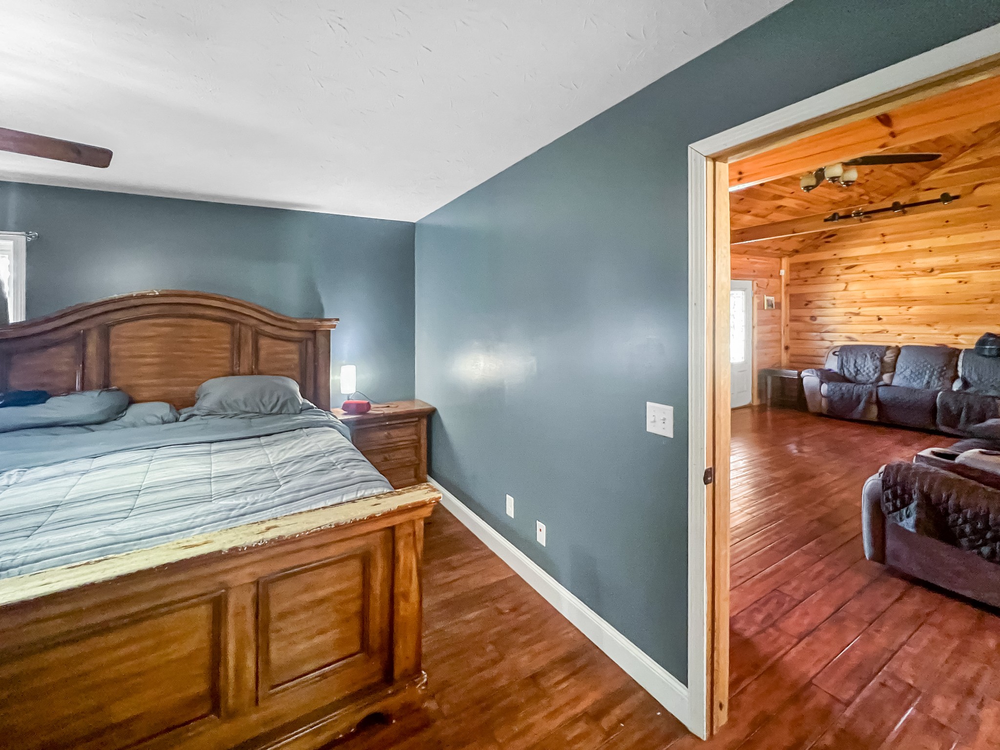 9516 Bakerton Road Red Boiling Springs, TN 37150 - Photo 29 of 60 a bedroom with a bed and wooden floor