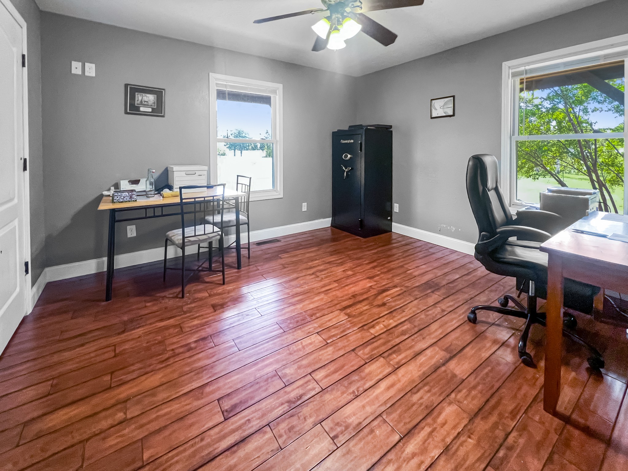 9516 Bakerton Road Red Boiling Springs, TN 37150 - Photo 33 of 60 a view of a workspace with wooden floor and a window
