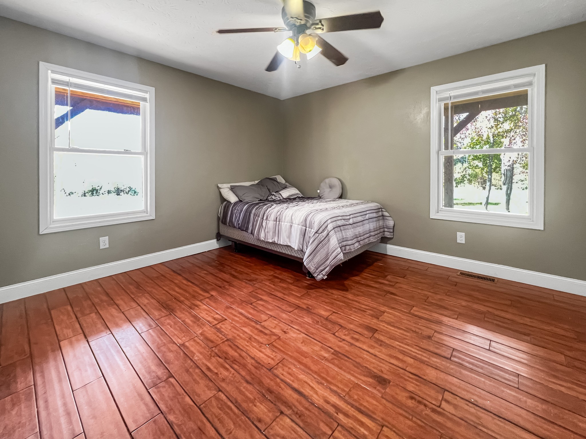 9516 Bakerton Road Red Boiling Springs, TN 37150 - Photo 35 of 60 a bedroom with wooden floor bed and a window