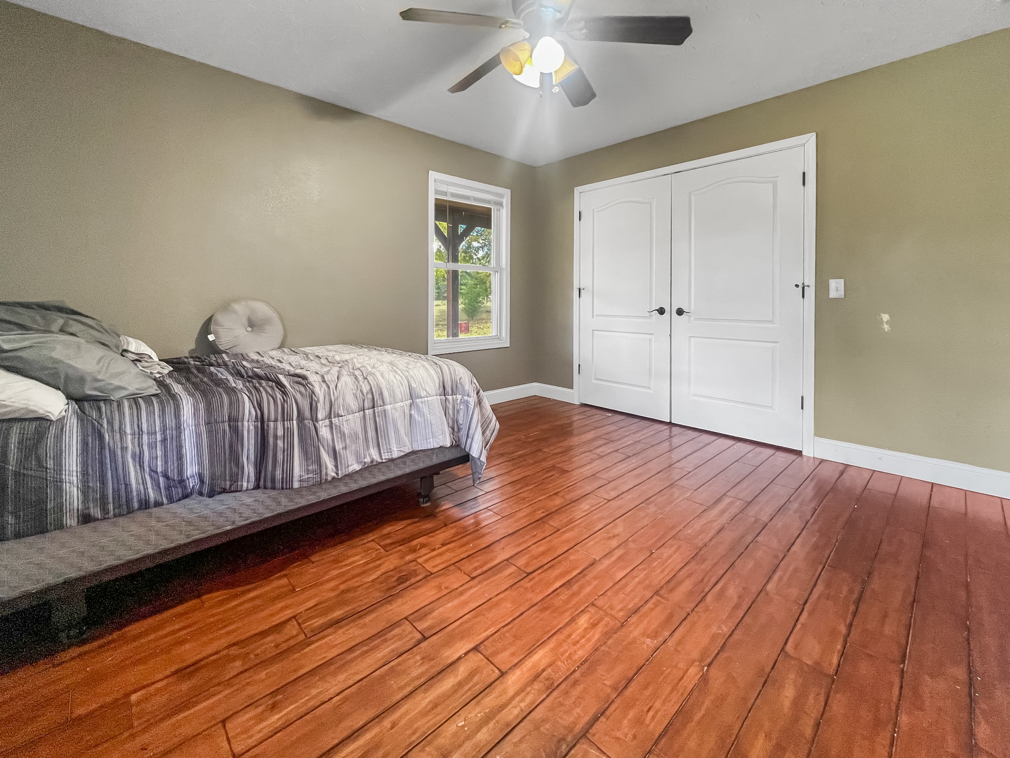 9516 Bakerton Road Red Boiling Springs, TN 37150 - Photo 36 of 60 a spacious bedroom with a bed and a window
