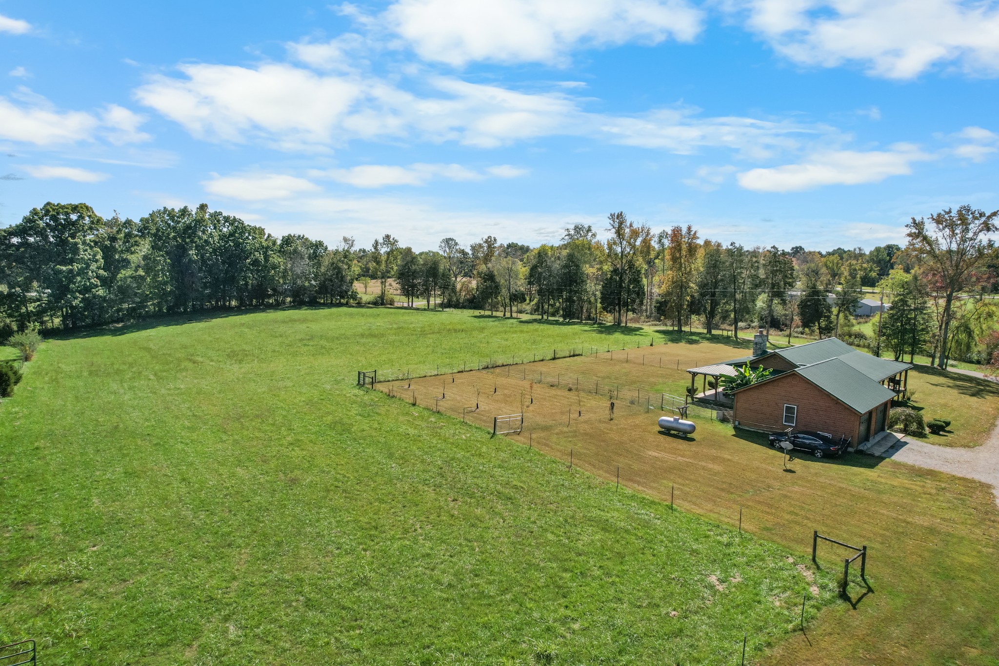 9516 Bakerton Road Red Boiling Springs, TN 37150 - Photo 10 of 60 a view of a grassy field with trees